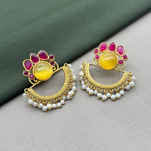 Diwam Jewels' gold-plated Traditional and Meenakari Earring Set featuring vibrant pink and yellow stones, paired with beautiful pearls