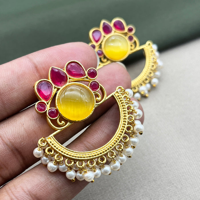 Diwam Jewels' gold-plated Traditional and Meenakari Earring Set featuring vibrant pink and yellow stones, paired with beautiful pearls