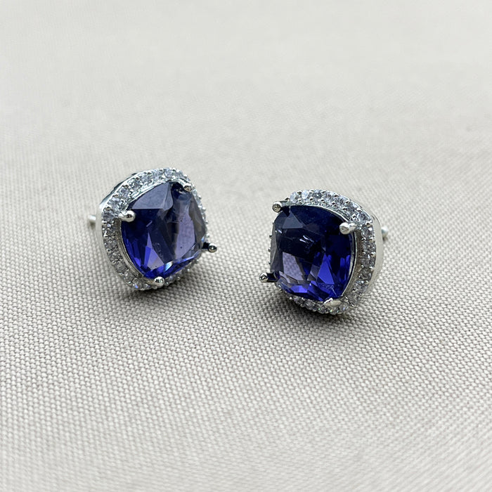 Elegant Silver Stud Earrings with Deep Blue Sapphire and Sparkling CZ Stones