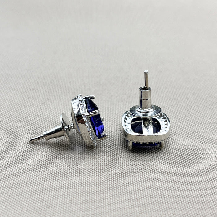 Elegant Silver Stud Earrings with Deep Blue Sapphire and Sparkling CZ Stones