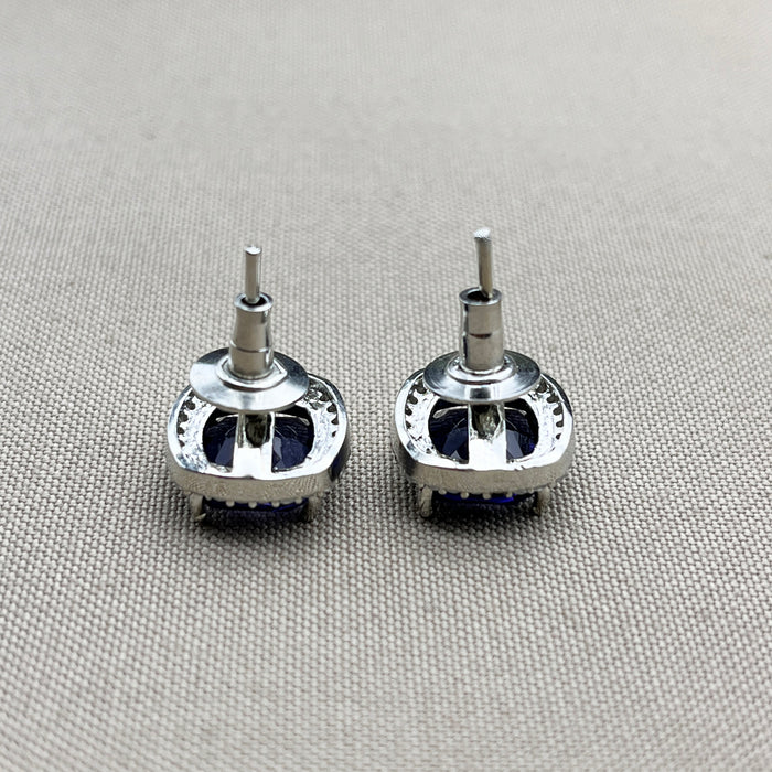 Elegant Silver Stud Earrings with Deep Blue Sapphire and Sparkling CZ Stones