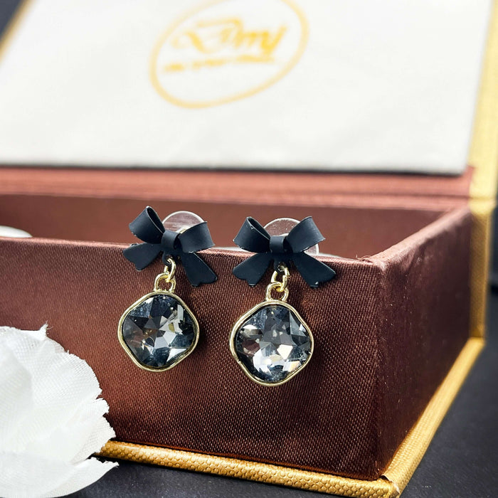 Elegant Black Bow & Crystal Drop Earrings – Gold Trimmed Statement Studs