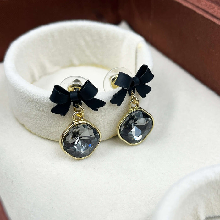 Elegant Black Bow & Crystal Drop Earrings – Gold Trimmed Statement Studs