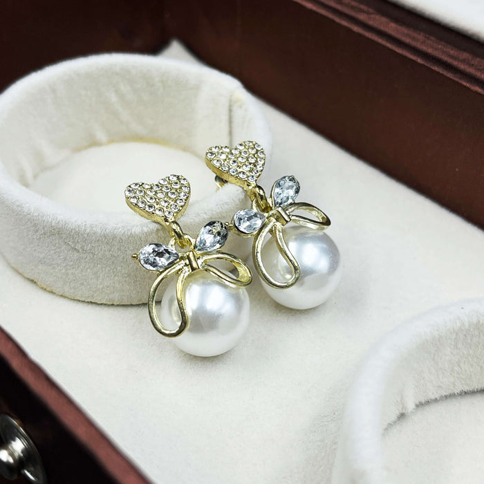 Gold-Plated Heart & Bow Pearl Drop Earrings with CZ Stones