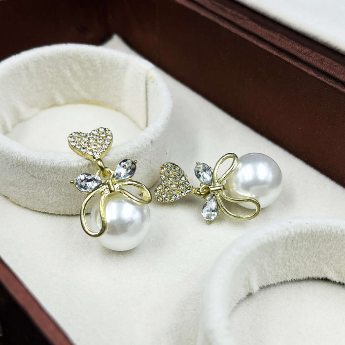 Gold-Plated Heart & Bow Pearl Drop Earrings with CZ Stones
