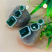 Elegant Silver-Plated Earrings Studded with Emerald Stone