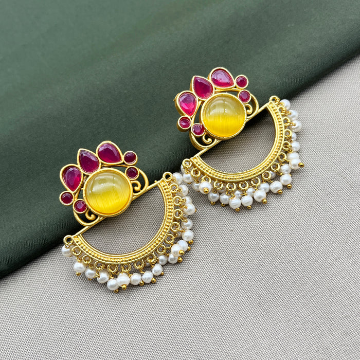 Diwam Jewels' gold-plated Traditional and Meenakari Earring Set featuring vibrant pink and yellow stones, paired with beautiful pearls