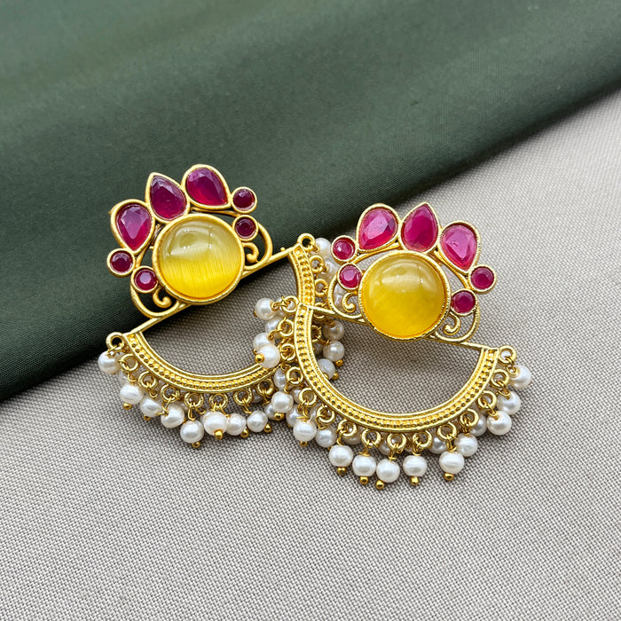 Diwam Jewels' gold-plated Traditional and Meenakari Earring Set featuring vibrant pink and yellow stones, paired with beautiful pearls