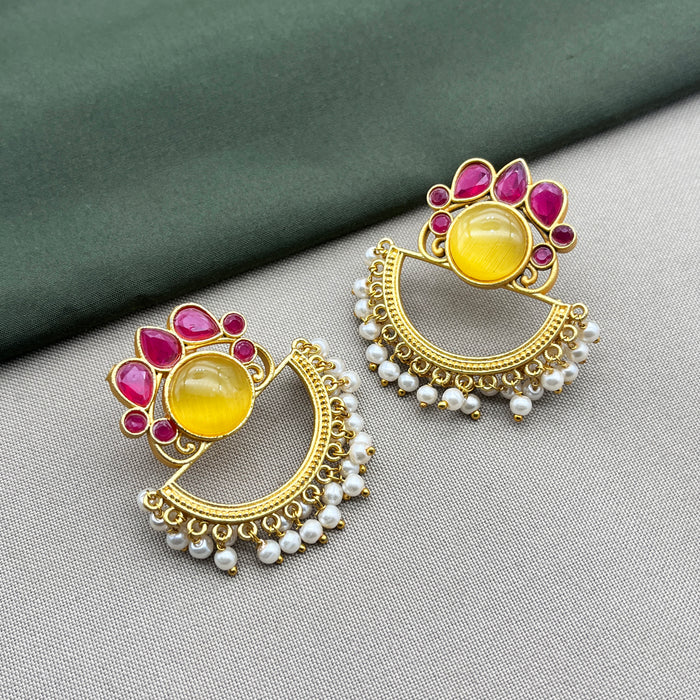 Diwam Jewels' gold-plated Traditional and Meenakari Earring Set featuring vibrant pink and yellow stones, paired with beautiful pearls