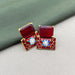 Meenakari Work Gold-Plated Earring Set studded with Garnet Brass