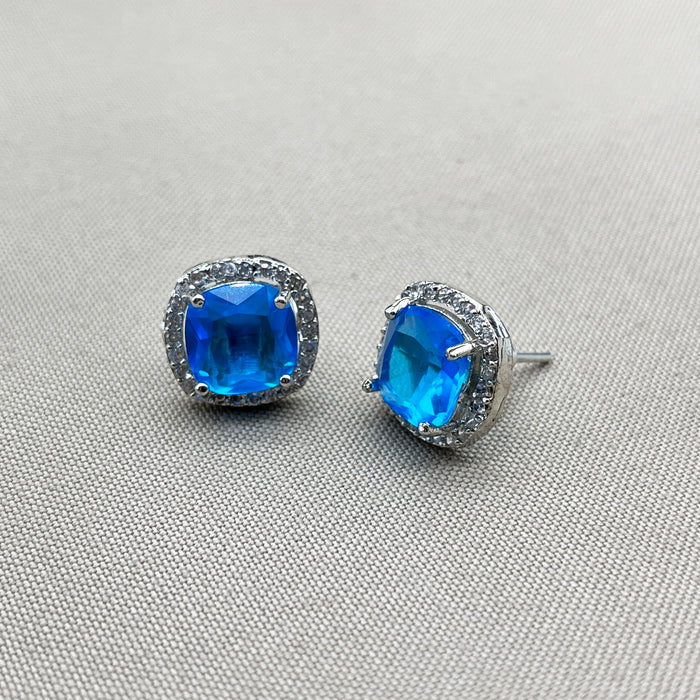 Elegant Silver Stud Earrings with Blue Topaz and CZ Stones