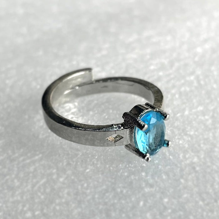 Sapphire Sparkle: Blue Topaz and CZ Silver Plated Ring by DiwamJewels