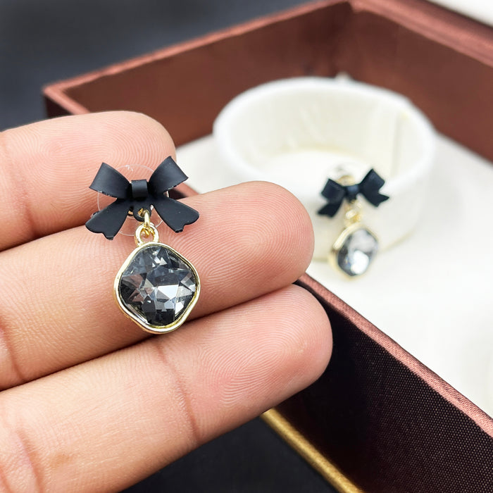Elegant Black Bow & Crystal Drop Earrings – Gold Trimmed Statement Studs