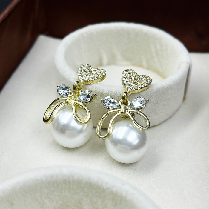Gold-Plated Heart & Bow Pearl Drop Earrings with CZ Stones