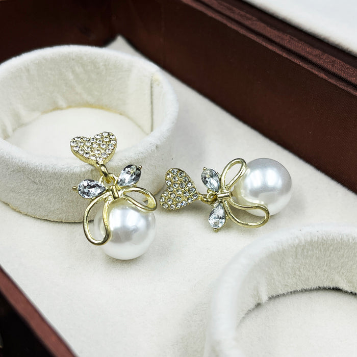 Gold-Plated Heart & Bow Pearl Drop Earrings with CZ Stones