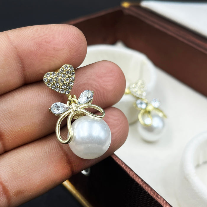 Gold-Plated Heart & Bow Pearl Drop Earrings with CZ Stones